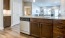 a kitchen with wooden cabinets