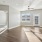 a large empty room with a wood floor