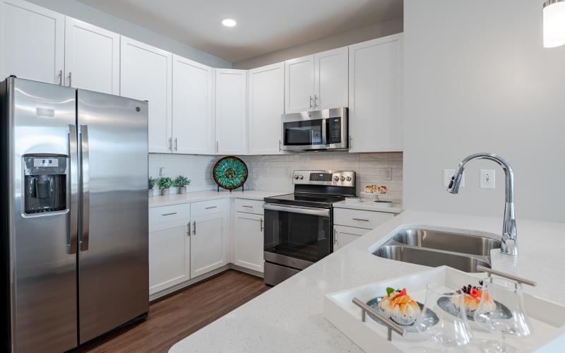 a kitchen with white cabinets