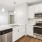 a kitchen with white cabinets