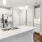 a kitchen with white cabinets