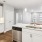 a kitchen with white cabinets