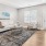 a living room with a couch and a rug