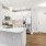 a kitchen with white cabinets