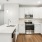a kitchen with white cabinets