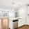 a kitchen with white cabinets